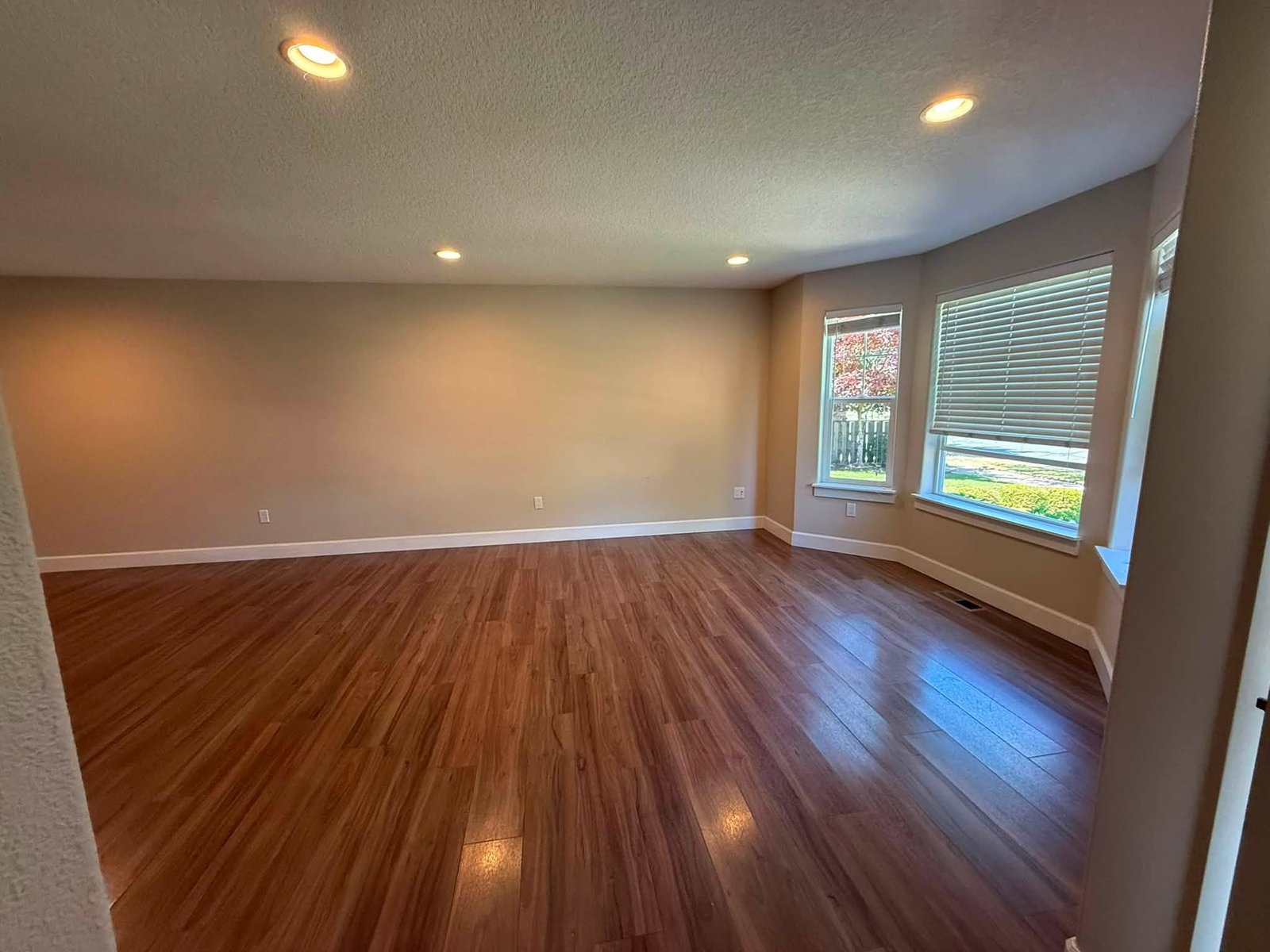 Bright living room with freshly painted walls and hardwood floors
